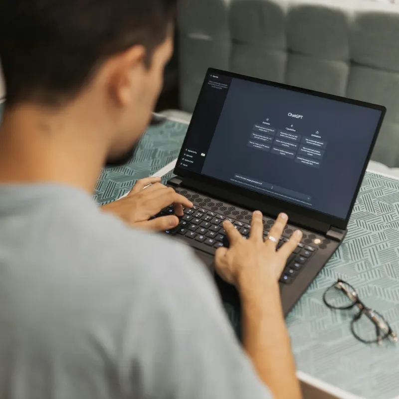 Person using an AI assistant on a laptop